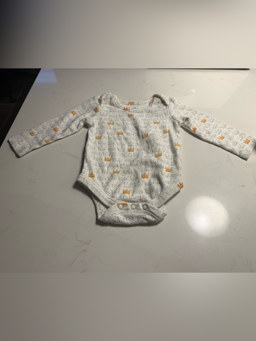 White Long-Sleeve Baby One-Piece with Gold Crown Print